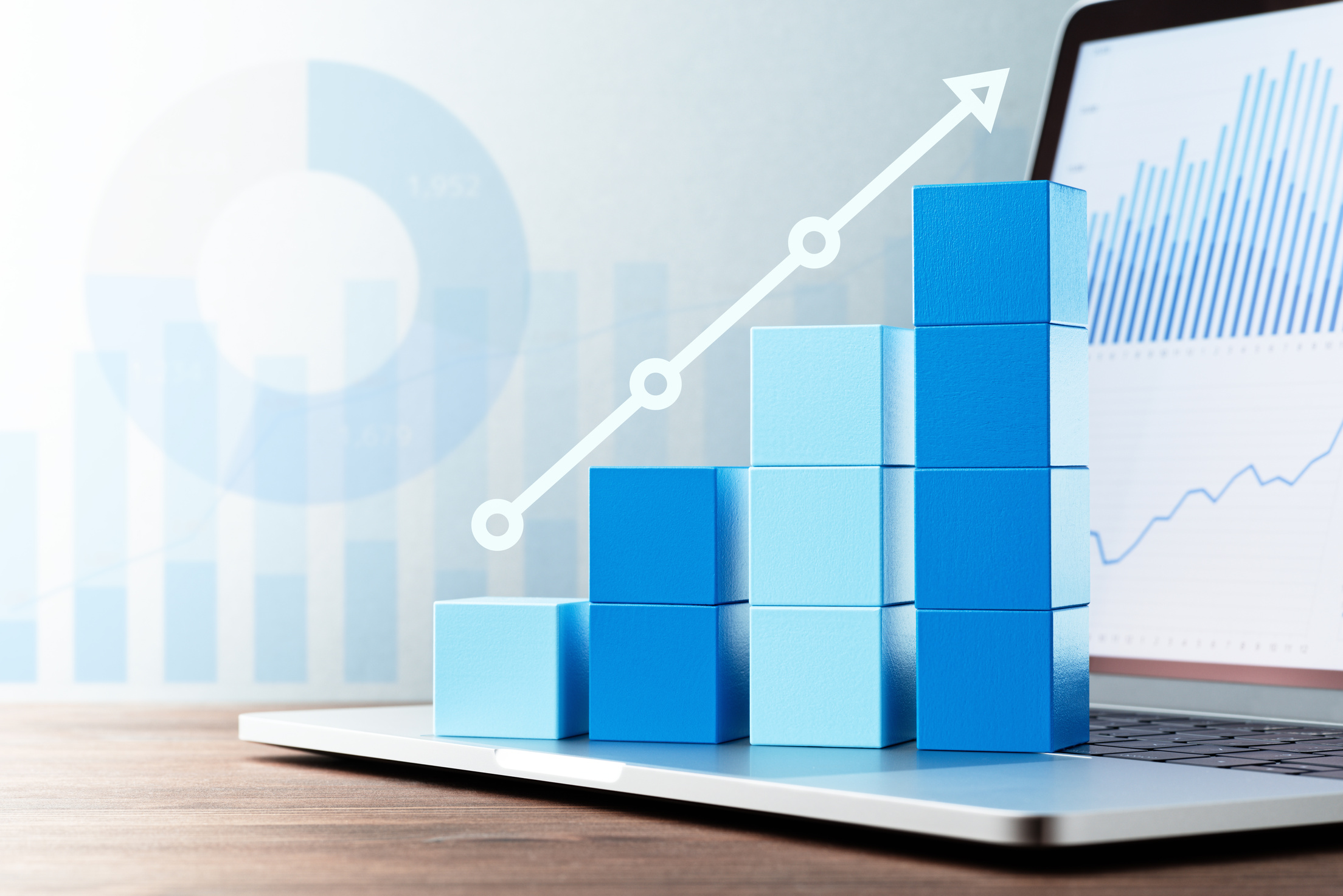 Business data analysis. Laptop on wood table.